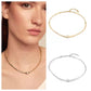  Choker on neutral or textured background. Alt: “UNOde50 Choker Necklace with White Cubic Zirconia.”