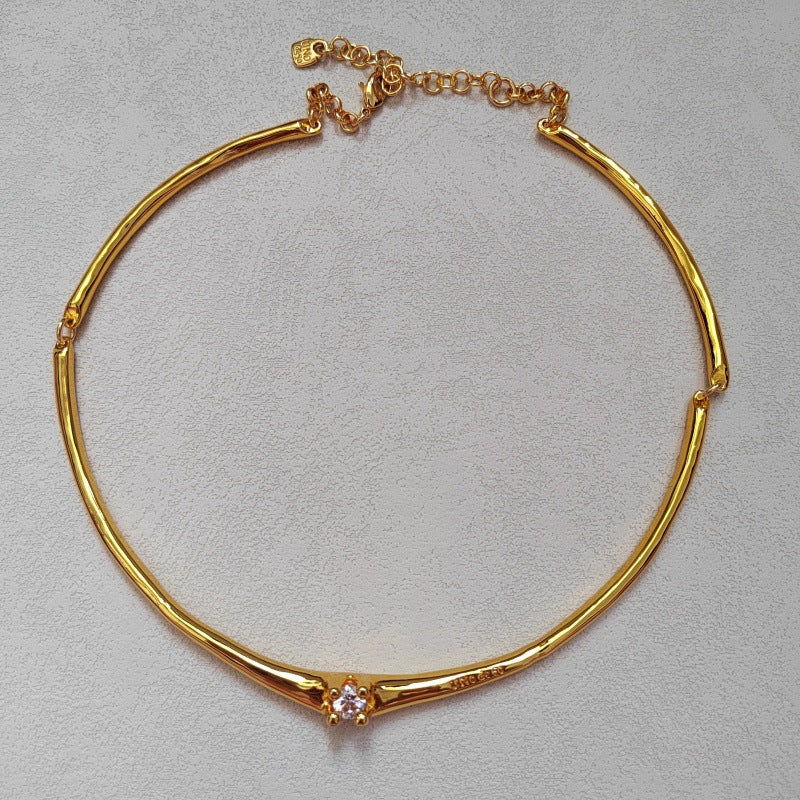  Choker on neutral or textured background. Alt: “UNOde50 Choker Necklace with White Cubic Zirconia.”