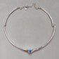  Choker on neutral or textured background. Alt: “UNOde50 Choker Necklace with White Cubic Zirconia.”