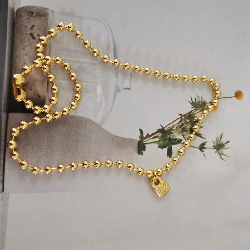 UNOde50 Gold-Tone Small Round Padlock Necklace