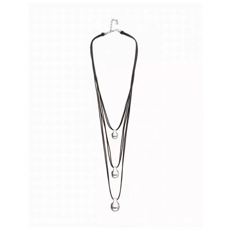 A multi-strand black cord necklace with silver-toned spherical beads and a silver clasp, displayed against a plain white background.