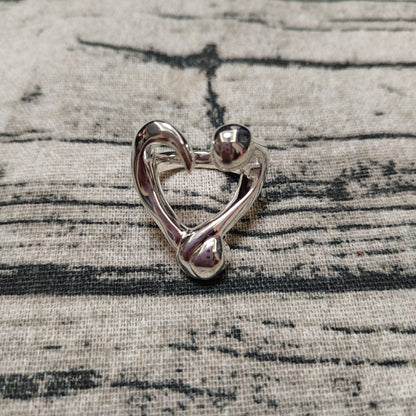 UNOde50 Open ring with a nailed heart