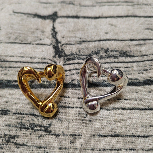 UNOde50 Open ring with a nailed heart