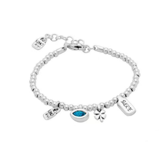 Charm bracelet on neutral background showing heart, clover, and hand. Alt: “UNOde50 Silver Heart, Clover & Hand Charm Bracelet.”