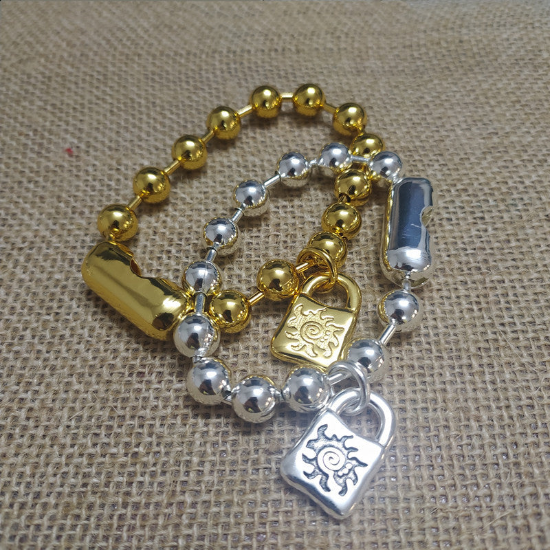 Gold snowflake bracelet on neutral or winter-inspired background. Alt: “UNOde50 Snowflake Bracelet Gold – Gold Snowflake Cuff.”