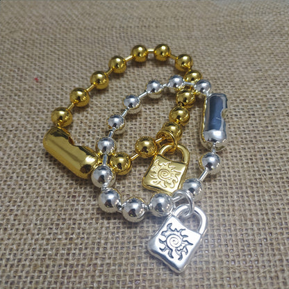 Gold snowflake bracelet on neutral or winter-inspired background. Alt: “UNOde50 Snowflake Bracelet Gold – Gold Snowflake Cuff.”