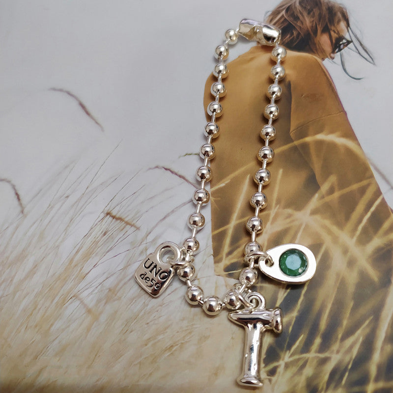 Gold snowflake bracelet on neutral or winter-inspired background. Alt: “UNOde50 Snowflake Bracelet Gold – Gold Snowflake Cuff.”