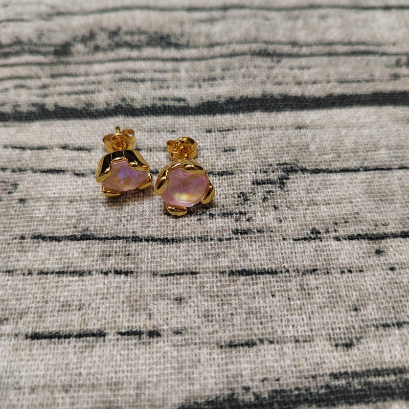 Blue crystal studs on neutral or ocean-inspired background. Alt: “UNOde50 Stud Earrings with Blue Crystal – Silver Sapphire Studs.”