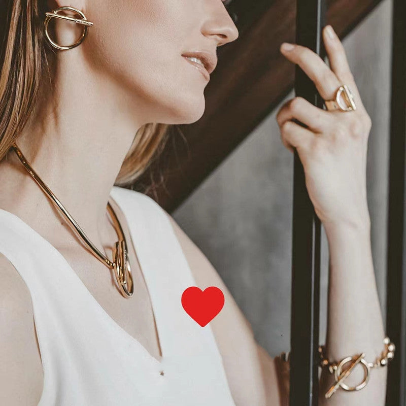  Earrings worn as playful statement. Alt: “Flip the Switch: UNOde50 Switch On.”