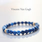 Blue beaded bracelet with gold accents on a white background, featuring the name 'Vincent Van Gogh'.