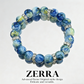Blue beaded bracelet with silver accents on a white background, featuring the brand 'Zerra'.