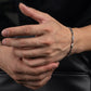 “Male model wearing vintage sterling silver bracelet”