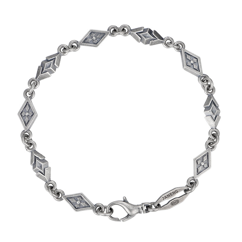 “Vintage oxidized 925 sterling silver diamond-pattern bracelet flat lay”