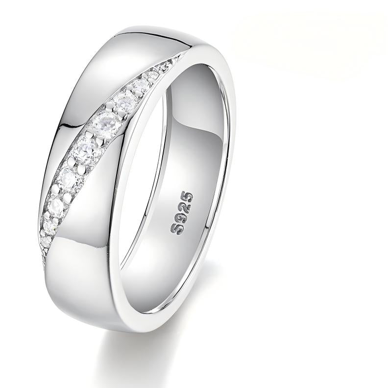 Bold flat lay featuring 4–5 wide-band rings on textured, unisex backdrop. Alt: “Wide-Band Moissanite Engagement Rings – Unisex Bold Collection.”