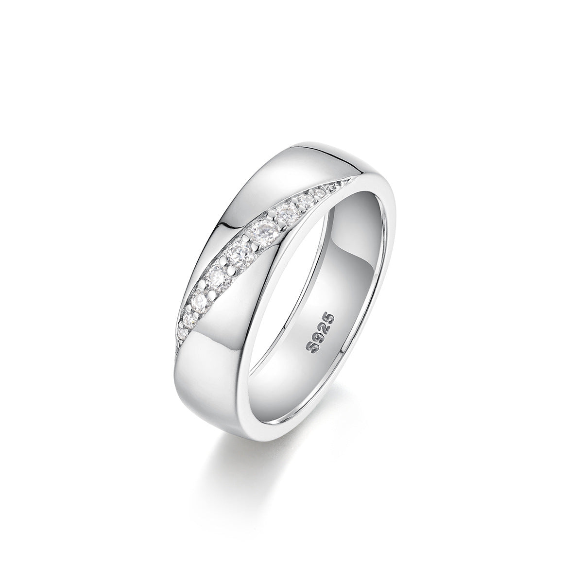 Bold flat lay featuring 4–5 wide-band rings on textured, unisex backdrop. Alt: “Wide-Band Moissanite Engagement Rings – Unisex Bold Collection.”