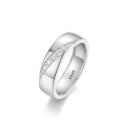 Bold flat lay featuring 4–5 wide-band rings on textured, unisex backdrop. Alt: “Wide-Band Moissanite Engagement Rings – Unisex Bold Collection.”