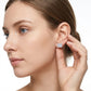 Model wearing Art Deco baguette and round moissanite stud earrings for modern vintage style.