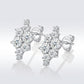 Asymmetric moissanite cluster stud earrings displayed on reflective surface with S925 stamp.