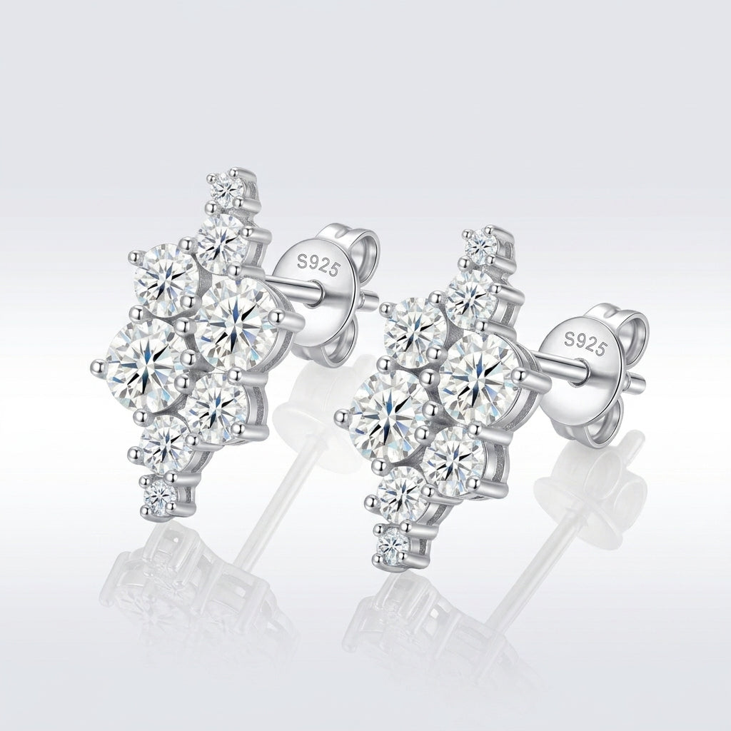 Asymmetric moissanite cluster stud earrings displayed on reflective surface with S925 stamp.