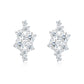 Asymmetric cluster moissanite stud earrings in sterling silver on white background.