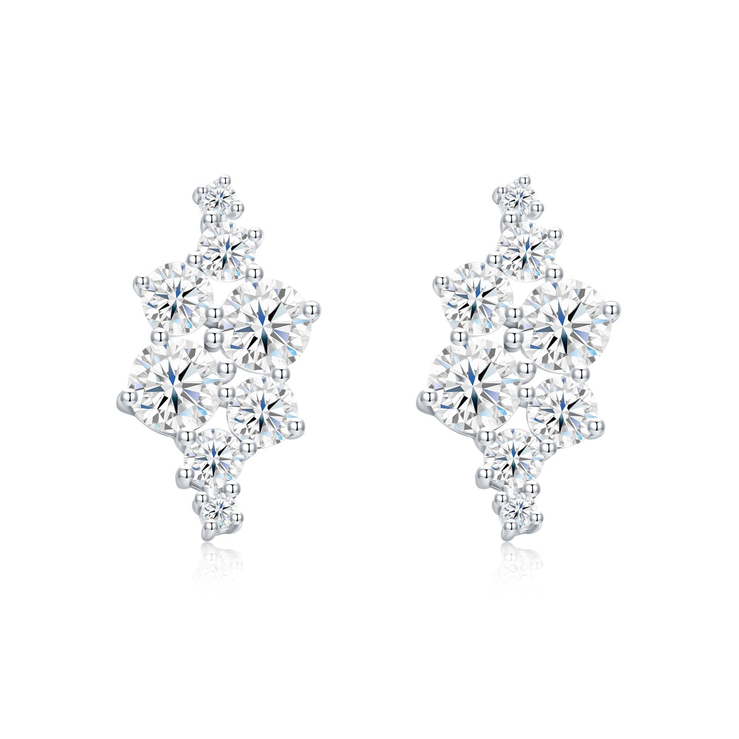Asymmetric cluster moissanite stud earrings in sterling silver on white background.