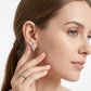 Model displaying asymmetric cluster moissanite stud earrings for everyday modern elegance.