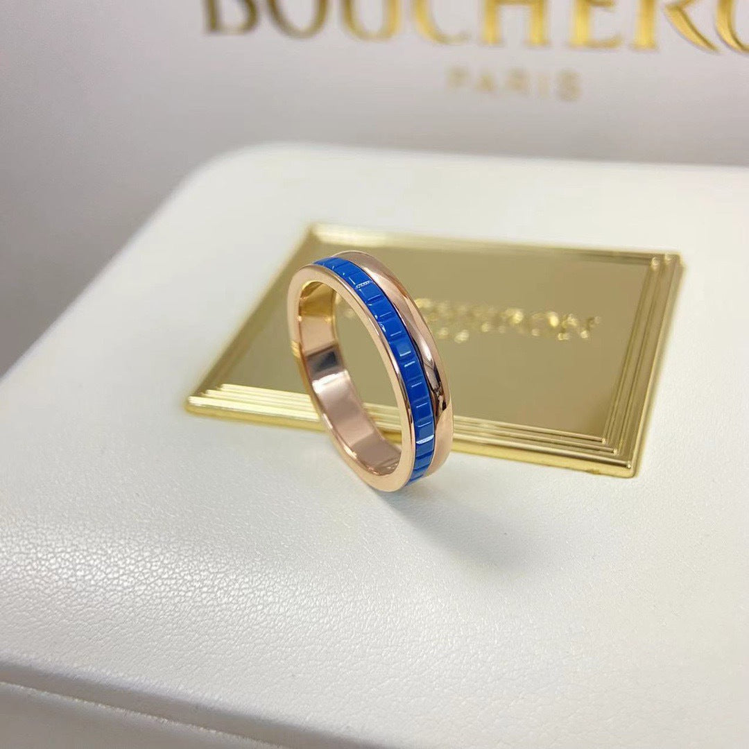 Front view of an avant-garde royal blue HyCeram ceramic statement ring with a rose gold plated finish on a jewelry box.