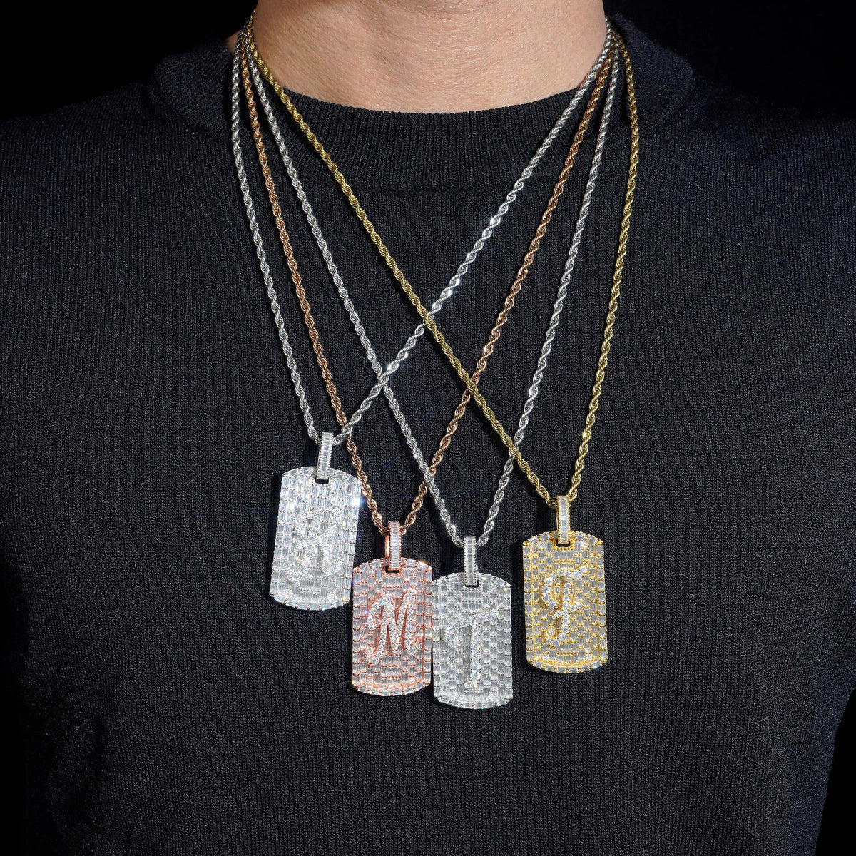 Model wearing layered S925 silver iced out moissanite baguette initial dog tag pendant necklaces
