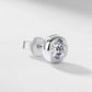 Close-up view of smooth bezel setting and ear nut on round diamond stud earring.