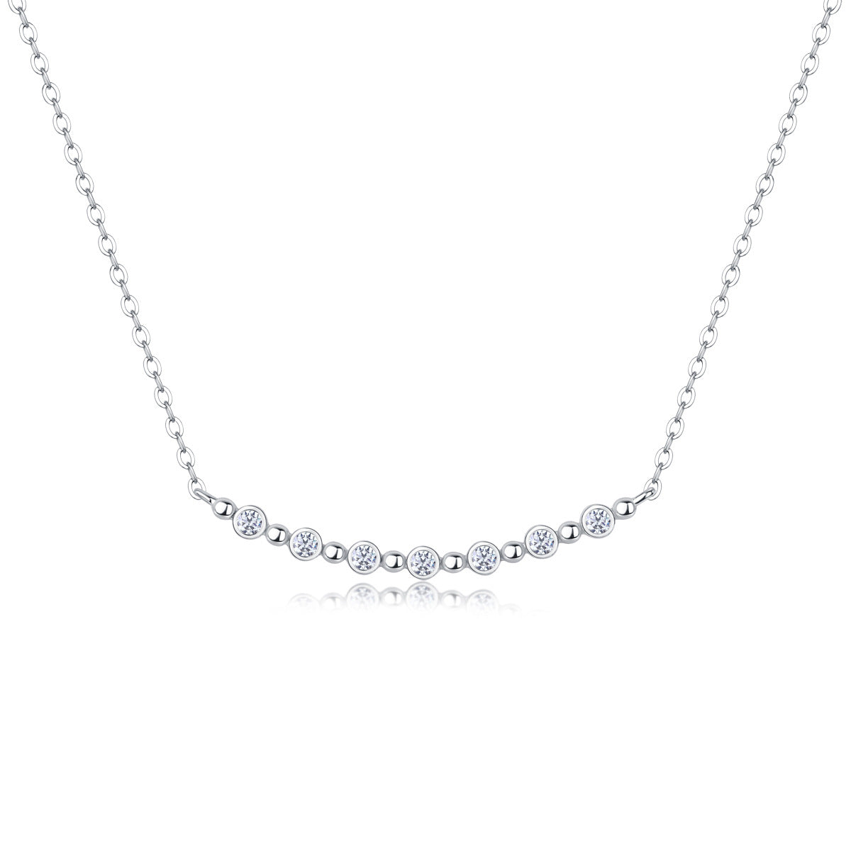Bezel set moissanite station smile bar necklace in sterling silver with bead spacers.