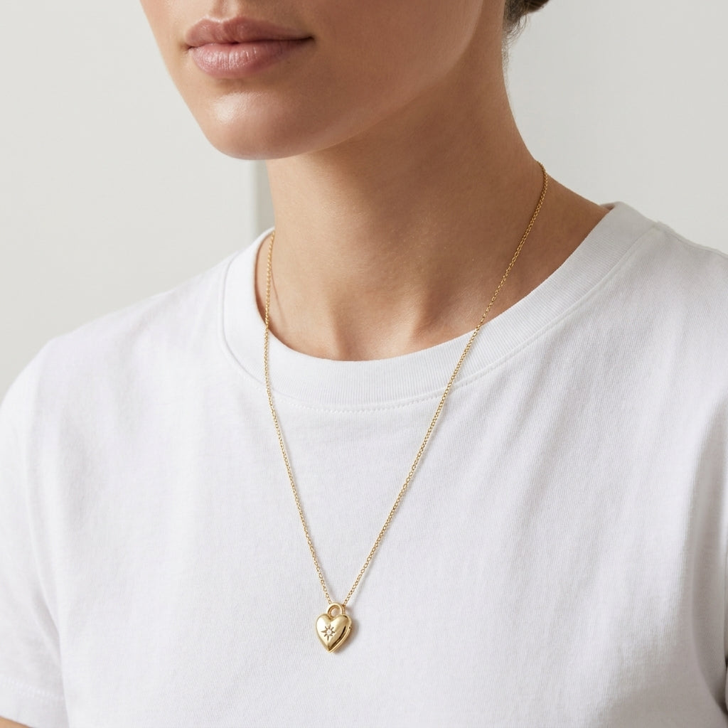 Model adjusts her hair wearing Bold Heirloom Heart Locket, showing the pendant in motion