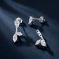 Pear cut studs and removable marquise leaf ear jackets displayed on dark background.