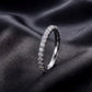 Side profile view of brilliant full eternity lab grown diamond ring on black silk