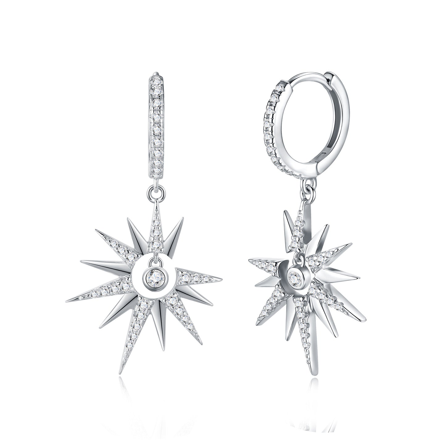Celestial moissanite starburst crescent moon dangle hoop earrings with pave huggie on white background.
