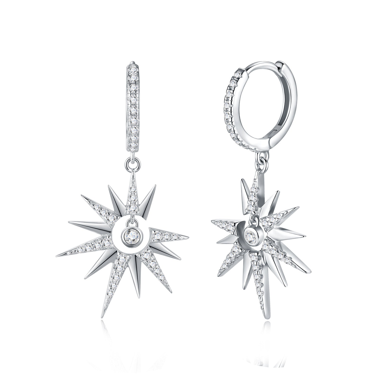 Celestial moissanite starburst crescent moon dangle hoop earrings with pave huggie on white background.