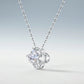Perspective view of celestial star cut moissanite openwork clover pendant necklace on slate background.