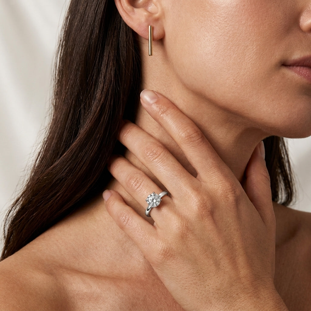 Model wearing classic 1.07ct round brilliant lab diamond solitaire engagement ring.