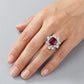 Top-down hand view of a model showcasing a classic asscher ruby statement cocktail ring on her ring finger.