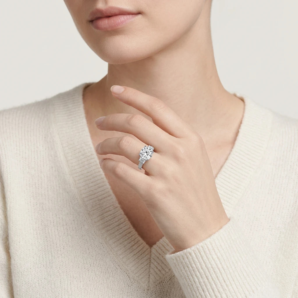 Editorial fashion lookbook portrait of a model showcasing a classic old money cushion moissanite three stone engagement ring.