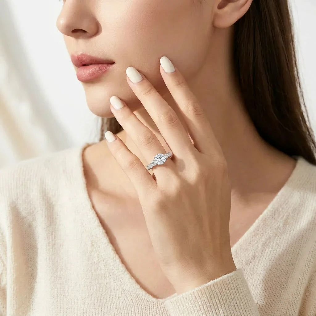 Editorial lifestyle wear portrait of a model showcasing a classic old money moissanite engagement ring with a hidden halo.