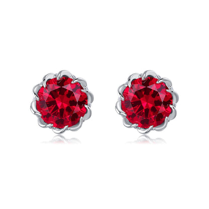 Classic round-cut created ruby stud earrings in 925 sterling silver flower setting, studio shot.