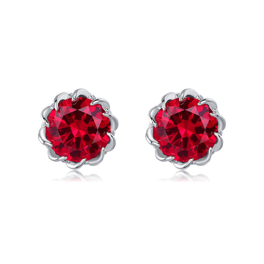Classic round-cut created ruby stud earrings in 925 sterling silver flower setting, studio shot.