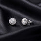 Close up showing front and side post profile of round halo lab grown diamond stud earrings on black silk