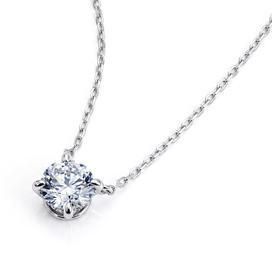 Side view showing four-prong basket setting of round solitaire pendant necklace.