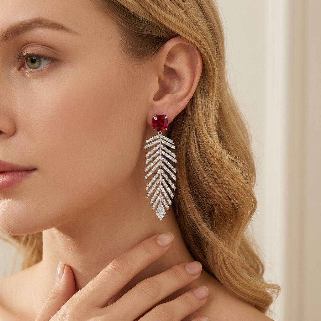 Close-up of a model wearing the princess-cut ruby wheat fringe earrings showcasing the elegant earlobe placement.