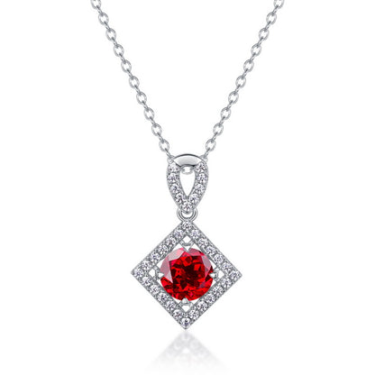 White background front view of a classic lab-grown ruby rhombus halo talisman pendant on a sterling silver chain.