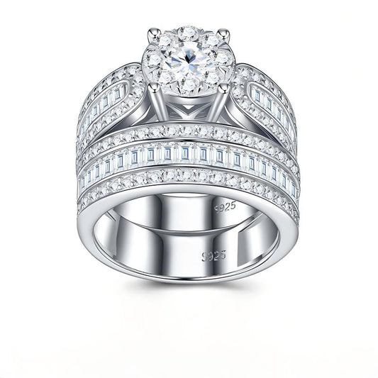 Classic silver round cut moissanite engagement ring with matching wide baguette pave wedding band set.