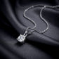 Angled shot of cushion cut lab grown diamond four-prong pendant on dark silk.