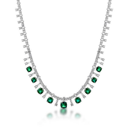 Cushion-cut emerald fringe statement necklace in sterling silver, studio white background.