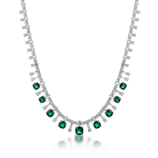 Cushion-cut emerald fringe statement necklace in sterling silver, studio white background.